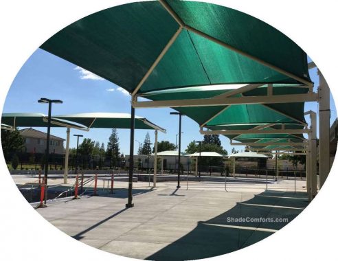 These tension fabric structures are designed as cantilever shade canopies.  They cover bleachers and cool the pool deck at a Sacramento aquatic center.