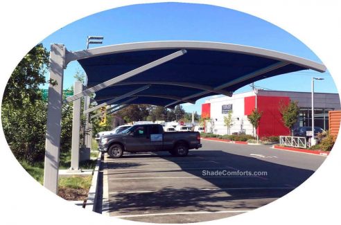 This tensioned fabric shade structure is designed as a commercial carport.  It creates permanent shade on a Sonoma parking lot.