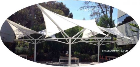 These tensioned fabric shade structures are designed as permanent hypar umbrellas.  They shade a San Jose courtyard.