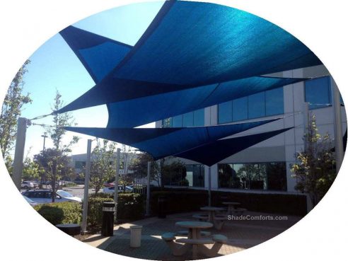 his tensioned fabric shade structure has commercial shade sail triangles.  It covers a San Francisco patio.
