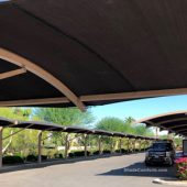 Car parking shade structures having arched cantilever beams in Inland Empire community of Coachella, CA in Riverside County.