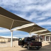 Fabric shade structures protect US Army tanks against UV damage and hot sun at Ft. Irwin. This base is in the Mojave Desert, which is one of the hottest places in the world.