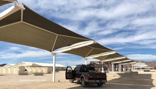 Fabric shade structures protect US Army tanks against UV damage and hot sun at Ft. Irwin. This base is in the Mojave Desert, which is one of the hottest places in the world.