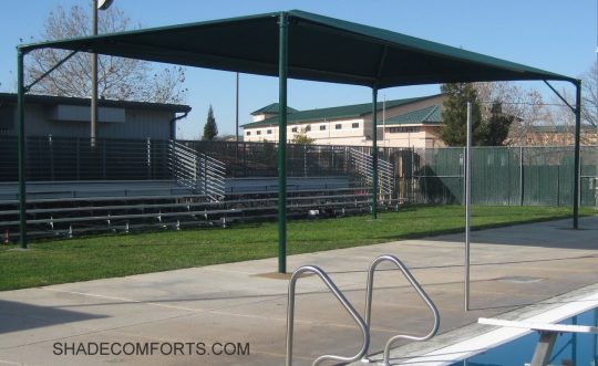 This fabric shade canopy cools the pool deck at a Placer County school.