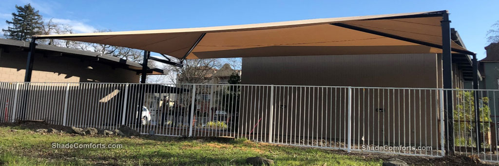 This fabric shade canopy structure cools the courtyard at aSonoma County church in Healdsburg, CA.  Shade Comforts was the design, manufacturing, and construction contractor.