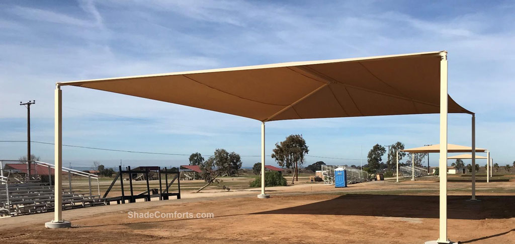 Fabric shade structures cover the target practice firing range at Camp Pendleton U.S. Marine Base near San Diego.  Each of the 3 structures has a hip roof measuring 50’x40’ with a 14’ clearance height.