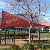 See photo of a tensile shade structure at a Santa Clara County manufacturing company. The hypar shade sail covers an outdoor fitness center used by employees.