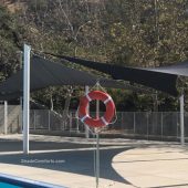 See photo of a tensile shade structure at a Los Angles school. Hypar shade sails cover the pool deck. Shade Comforts was the design build contractor.