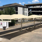 This parking shade structure in Dallas, Texas cools 40 cars spanning 6,156 square feet.