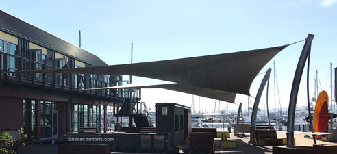 This commercial shade sail structure is custom engineered for a San Diego patio.
