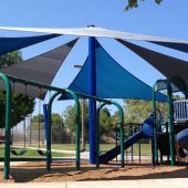 Outdoor play area shade sails structure creates a permanent sun protection canopy