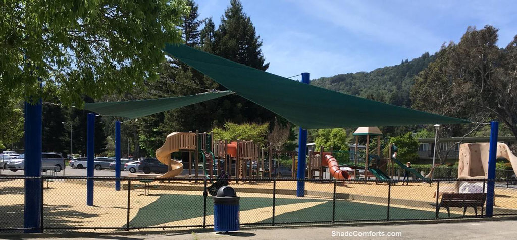 This shade sails structure cools the playground in the Marin County community of Corte Madera. Located at Town Park, it has (2) triangular sails supported by (5) posts.