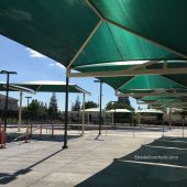 These fabric shade structures cool the aquatic center pool decks at Pat O’brien Community Center in Sacramento. Three structures collectively cool 4,475 square feet of hot pool deck.