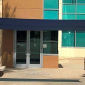 A cantilevered shade sail cools the front entrance at Kaiser Permanente Hospital in Riverside County, CA.