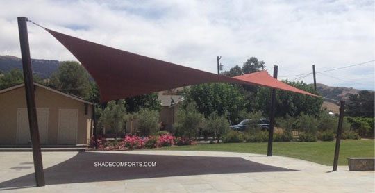 See photo of a tensile shade structure covering the hospitality patio at a San Jose vineyard. The fabric has hypar geometry