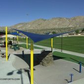 See photo of tensile shade structures covering a San Bernardino County playground. Each hypar shade sail is 30’x30’.